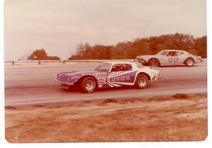 Don Gregory goes by Richard Coffin during hot laps....jpg